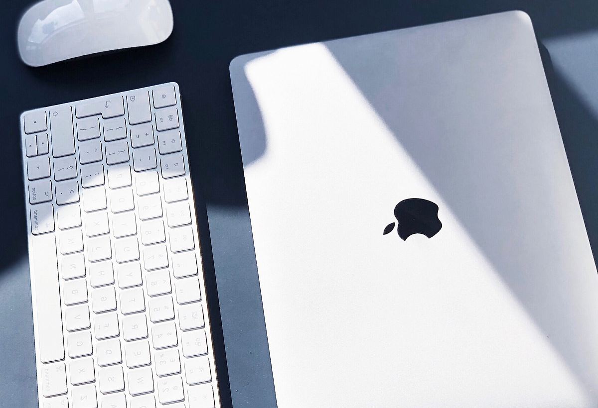 flat lay photography of MacBook white, Apple Wireless Keyboard, and Magic Mouse